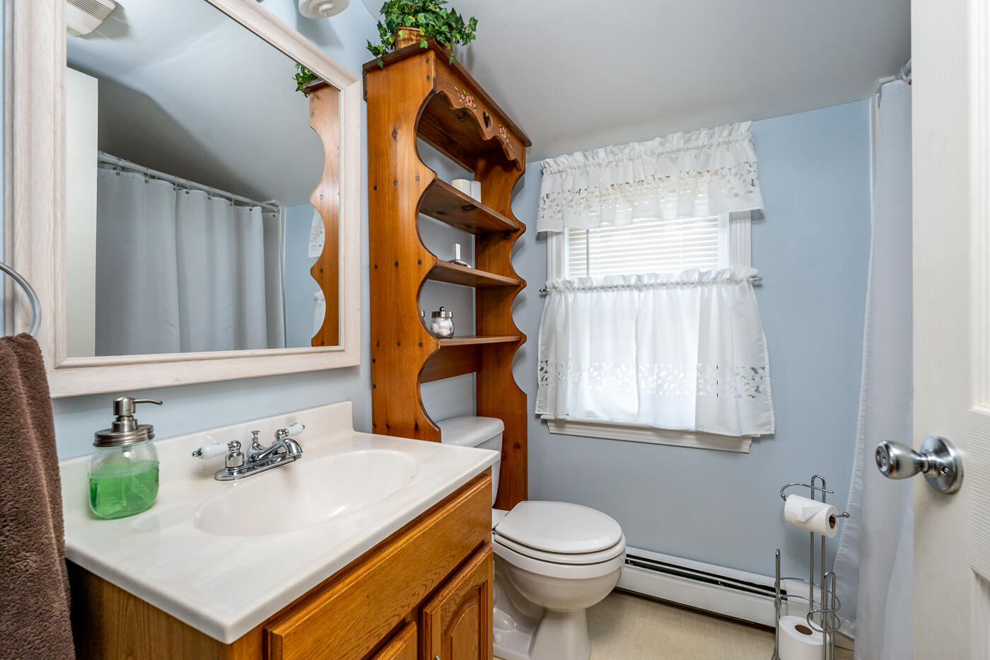 110 Bacon Road Hyannis, MA 02601 - Photo 24 of 37 a bathroom with a sink a toilet and a window