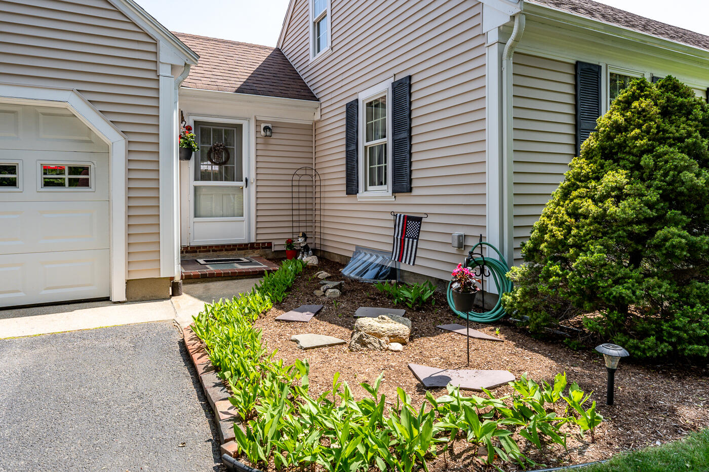 110 Bacon Road Hyannis, MA 02601 - Photo 27 of 37 a front view of a house with garden