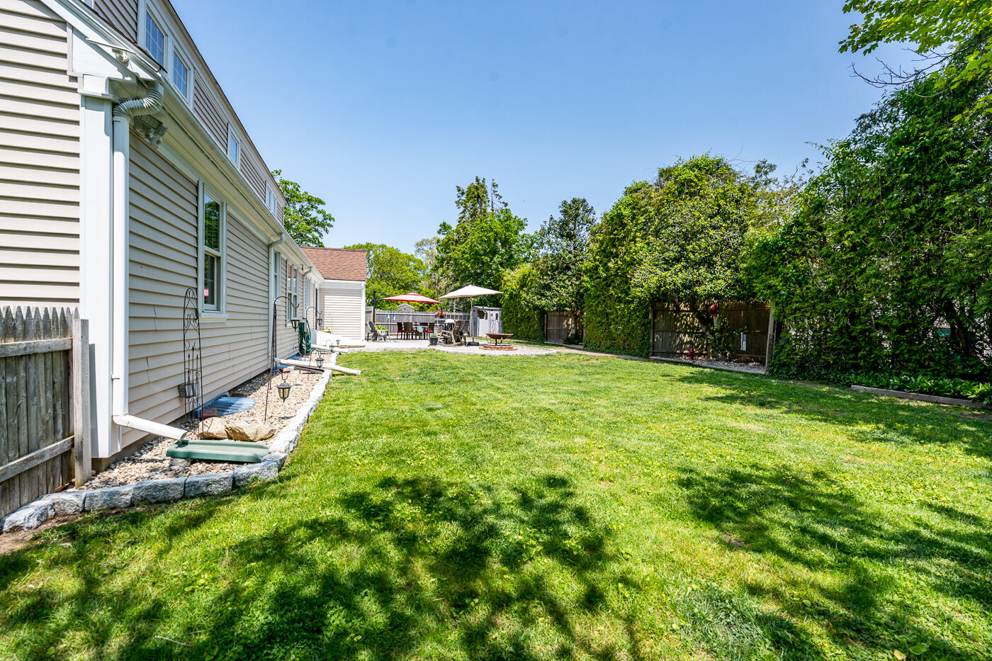 110 Bacon Road Hyannis, MA 02601 - Photo 33 of 37 a view of backyard with a table and chair