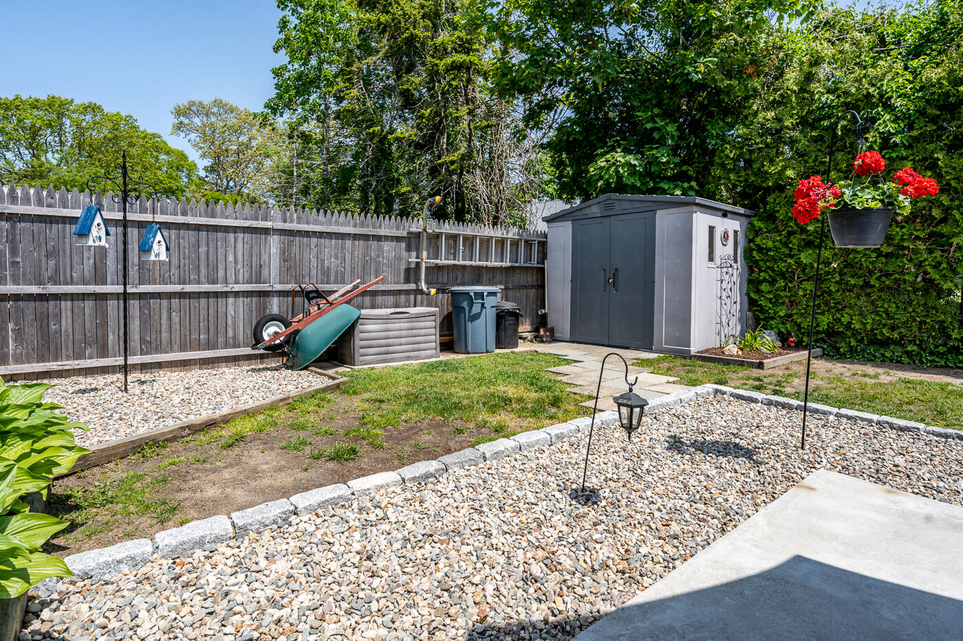110 Bacon Road Hyannis, MA 02601 - Photo 34 of 37 a backyard of a house with a garden