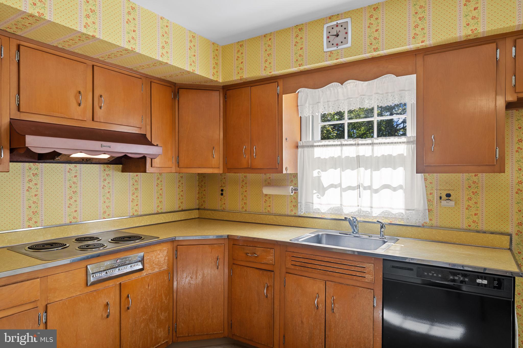 962 Weadley Road Radnor, PA 19087 - Photo 11 of 45 a kitchen with stainless steel appliances granite countertop a sink a stove and a microwave