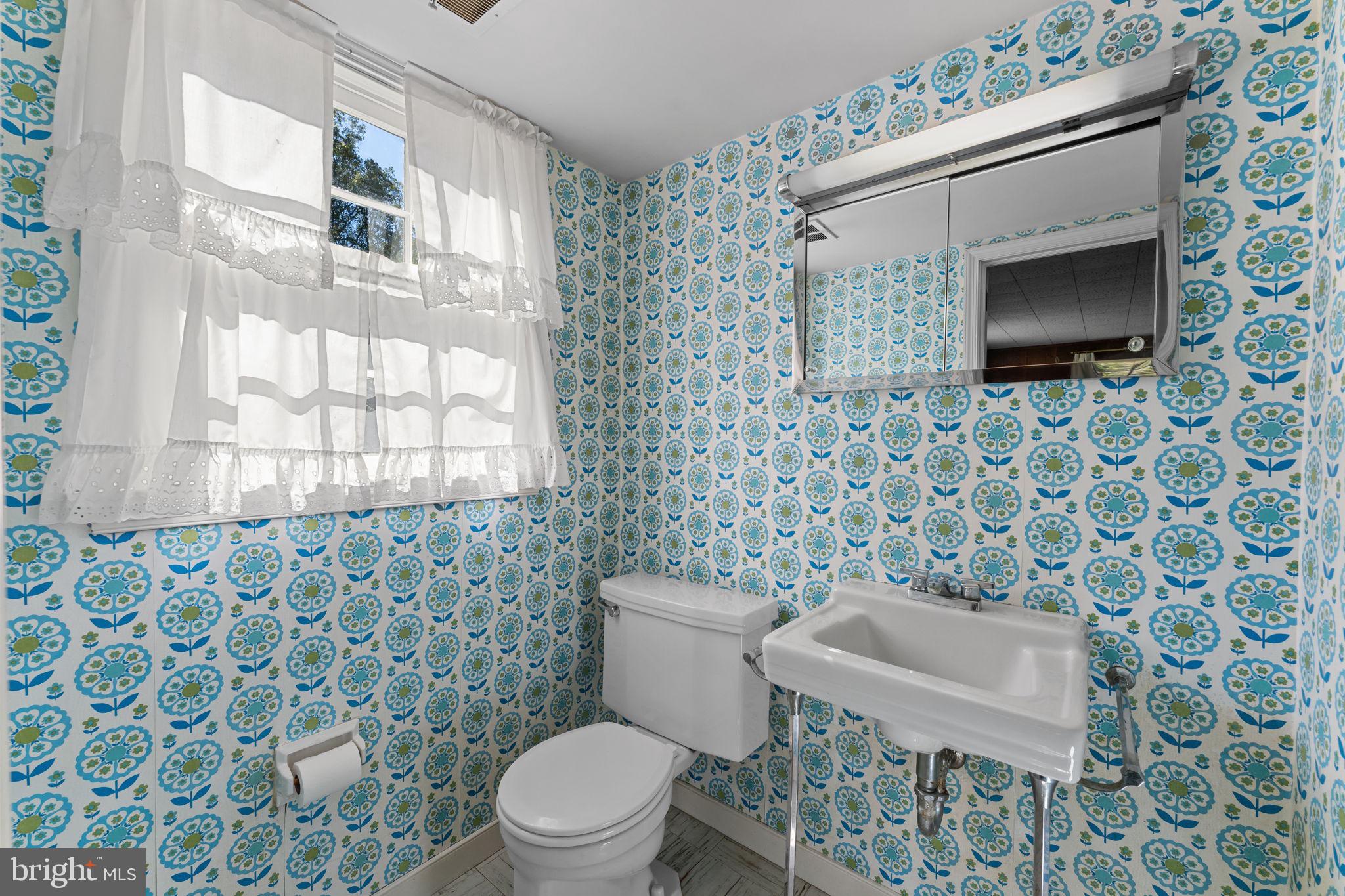 962 Weadley Road Radnor, PA 19087 - Photo 15 of 45 a white toilet sitting next to a small sink