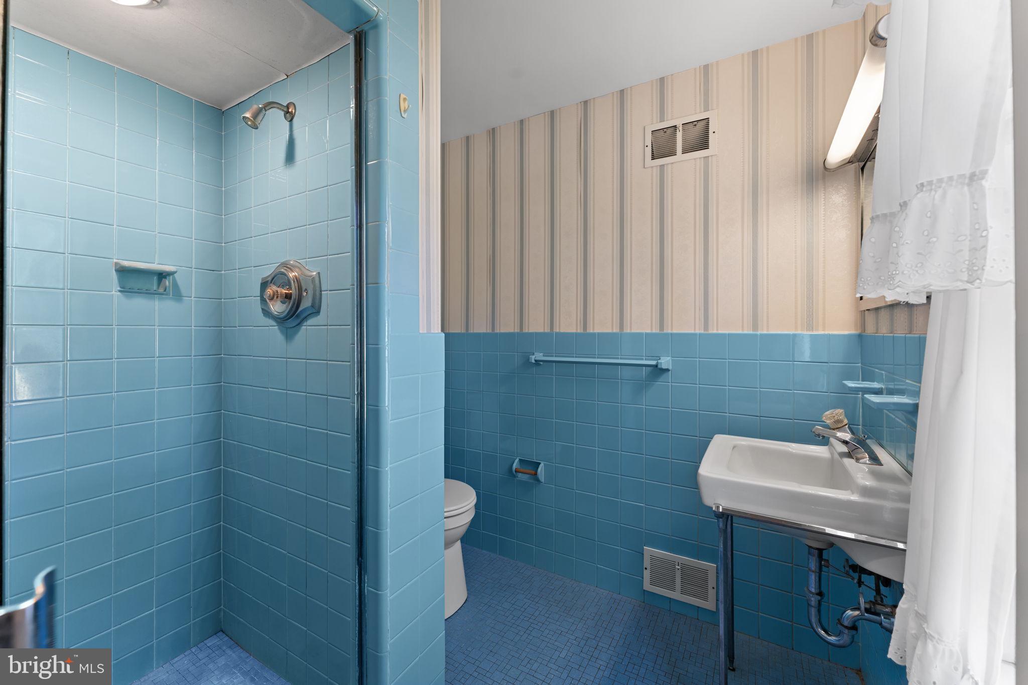 962 Weadley Road Radnor, PA 19087 - Photo 18 of 45 a bathroom with a sink a toilet and shower