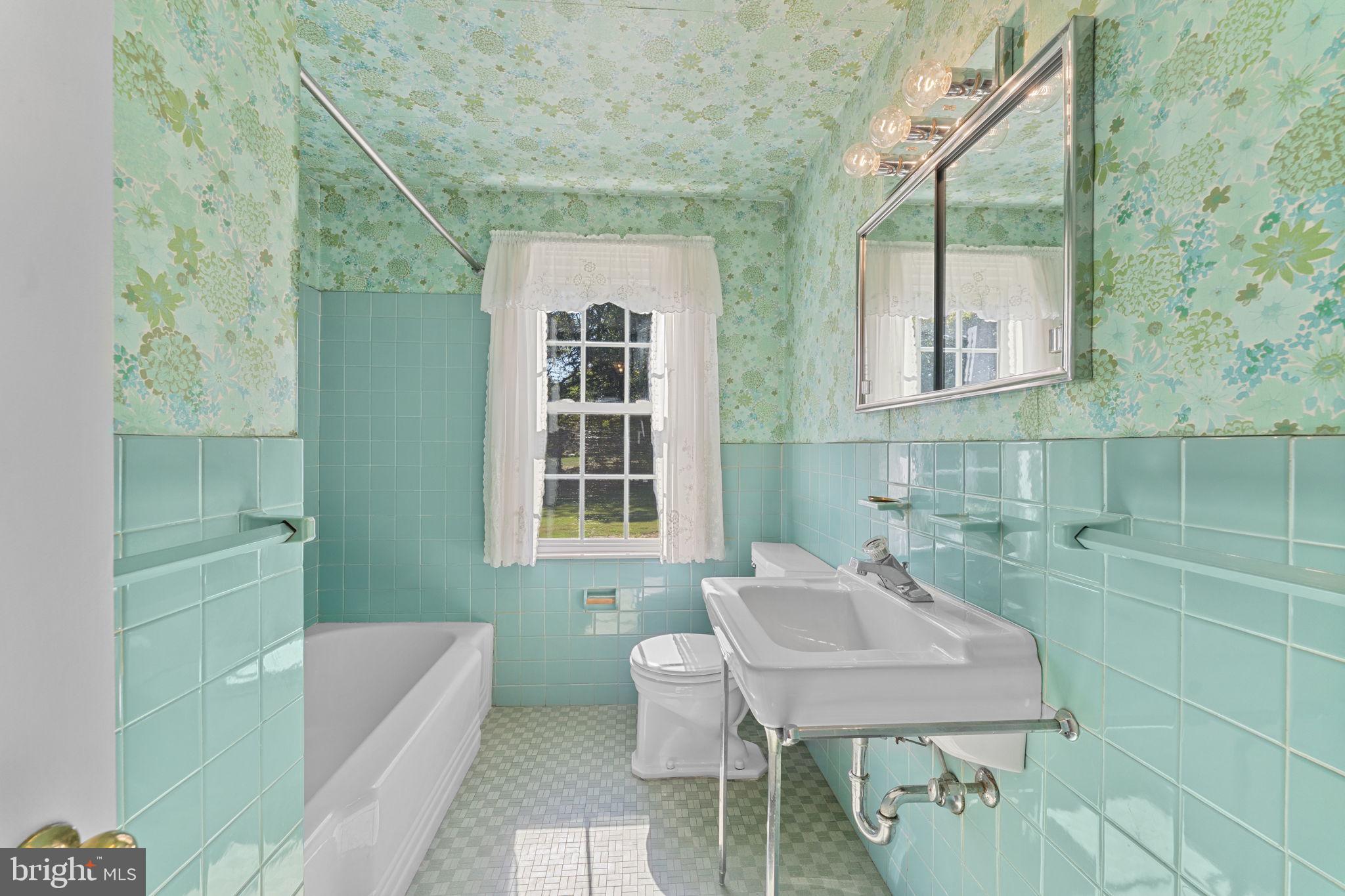 962 Weadley Road Radnor, PA 19087 - Photo 23 of 45 a bathroom with a sink toilet and a mirror
