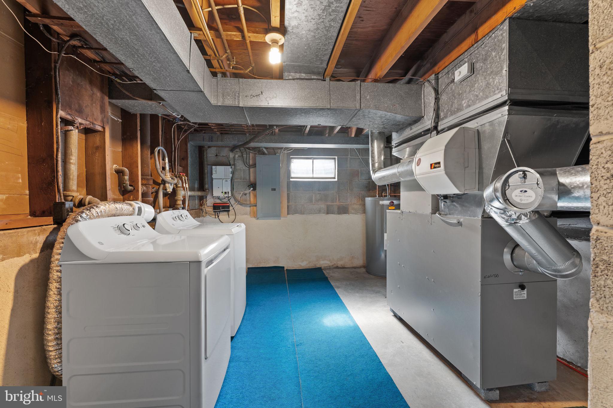 962 Weadley Road Radnor, PA 19087 - Photo 27 of 45 a utility room with a sink a washer and dryer
