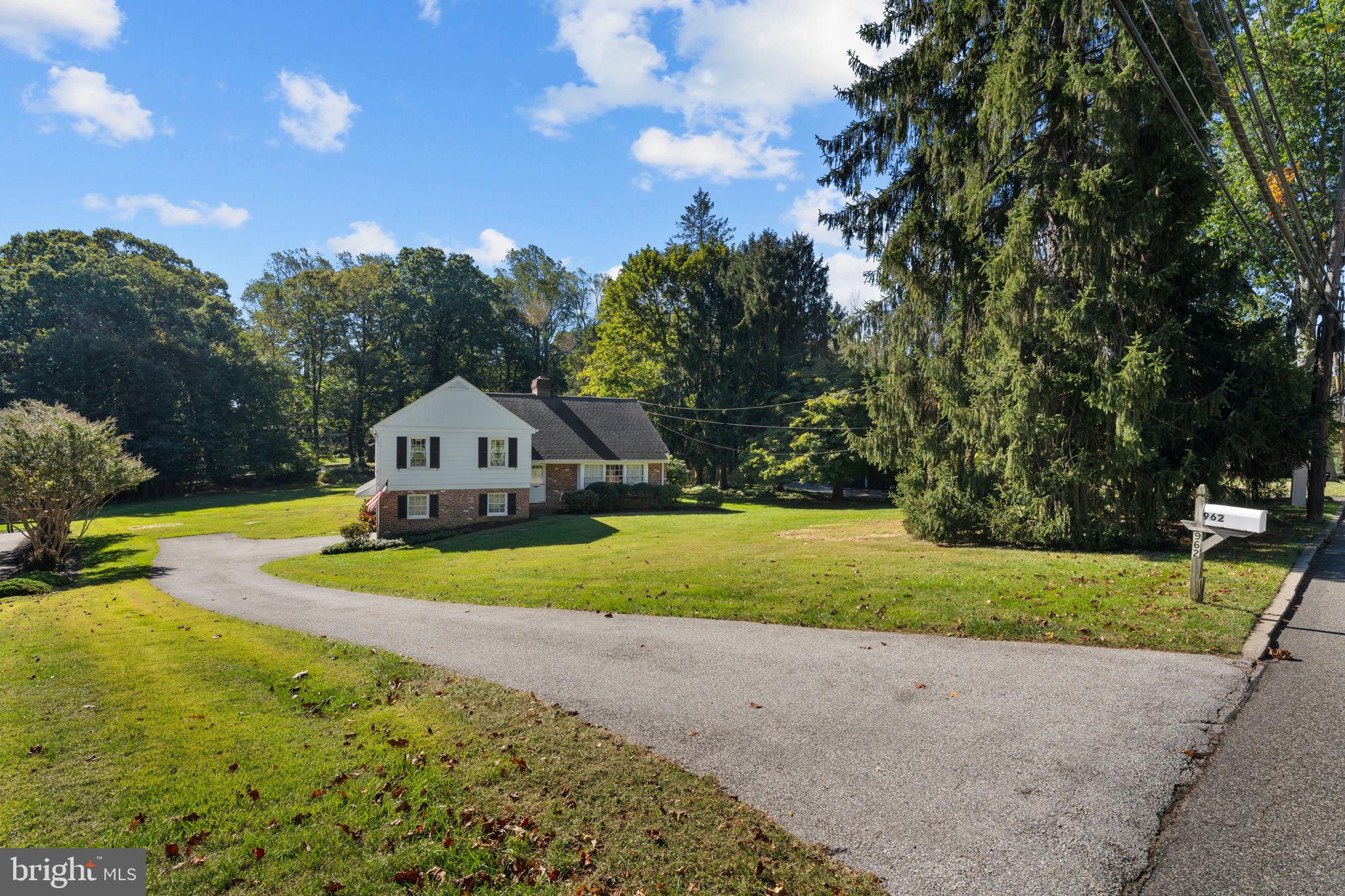 962 Weadley Road Radnor, PA 19087 - Photo 36 of 45 a front view of a house with garden