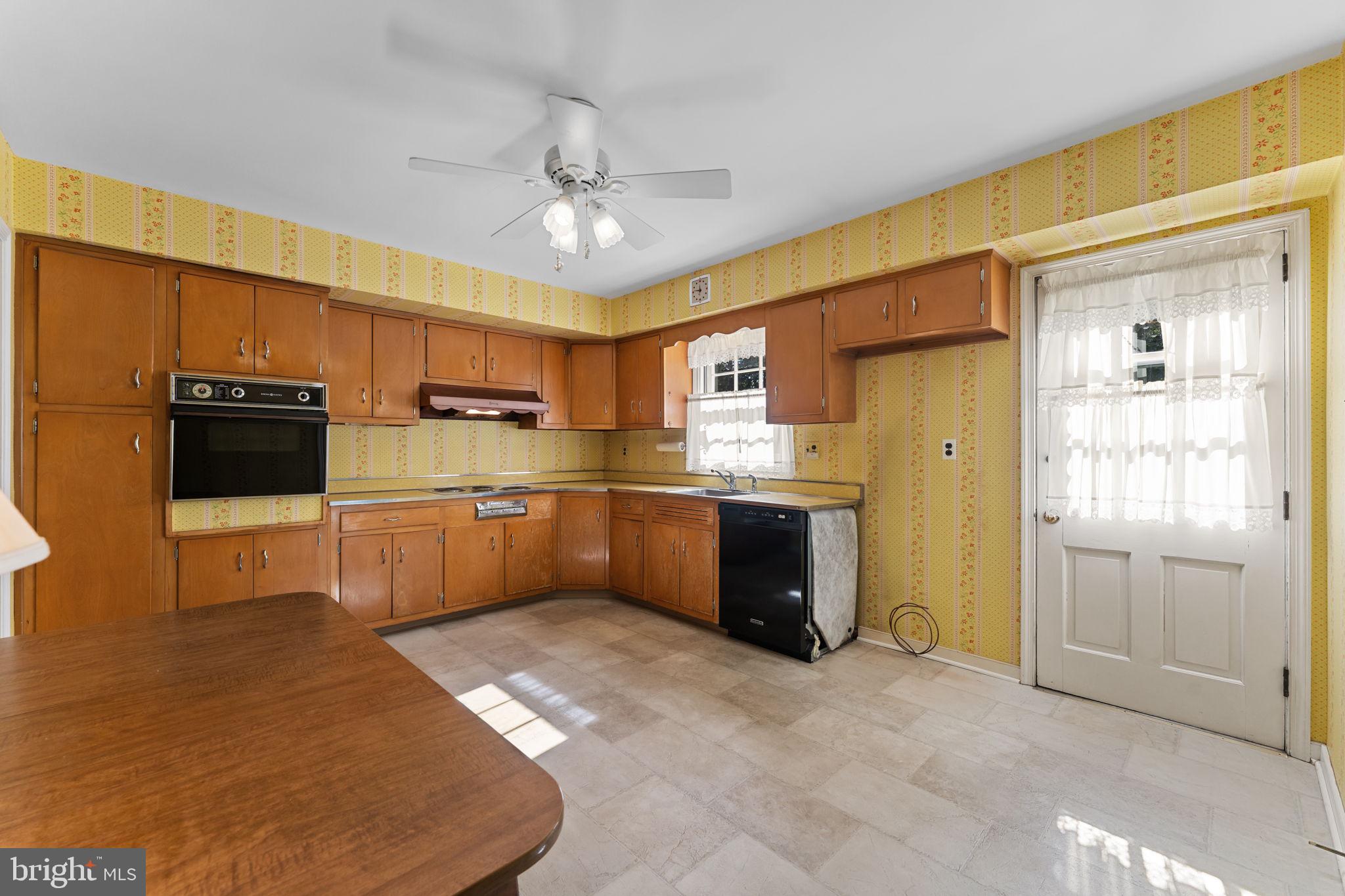 962 Weadley Road Radnor, PA 19087 - Photo 10 of 45 a kitchen with stainless steel appliances kitchen island granite countertop a refrigerator a stove top oven a sink and dishwasher