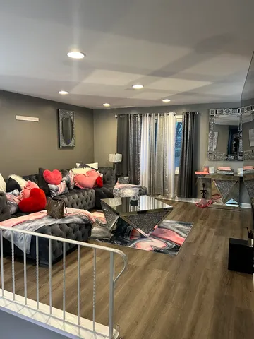 a bed room with furniture and a large window