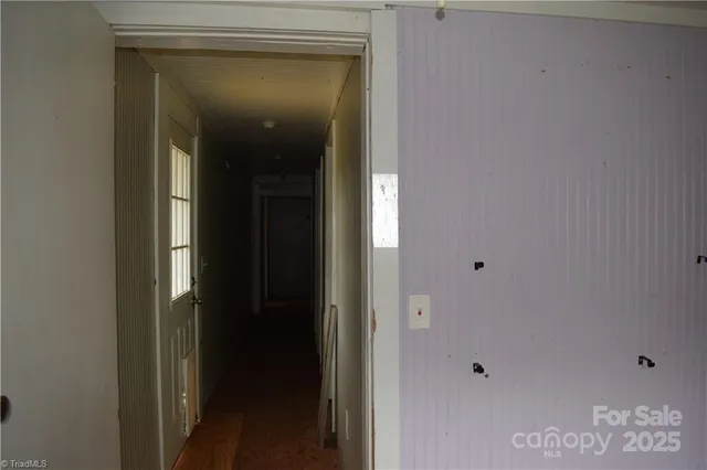 a view of a room with a window and a ceiling fan