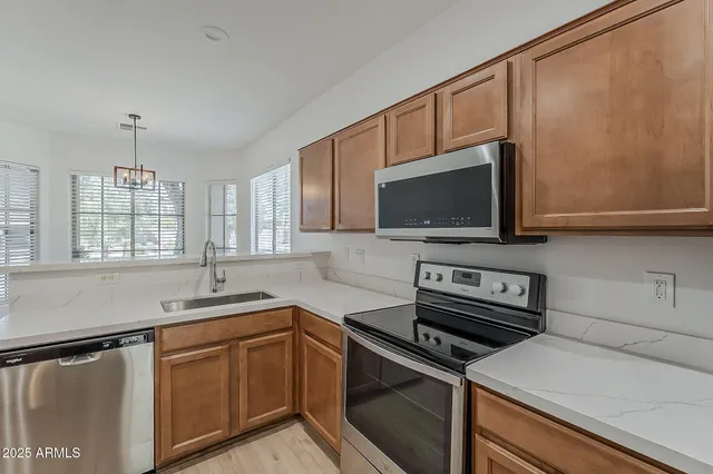 a kitchen with a sink and cabinets
