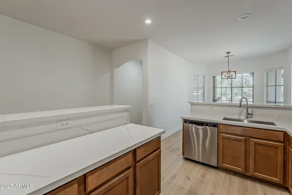 a view of kitchen with microwave and cabinets