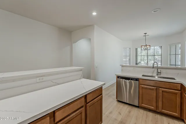a view of kitchen with microwave and cabinets