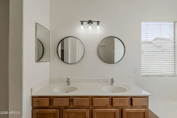 a bathroom with a bathtub and a window