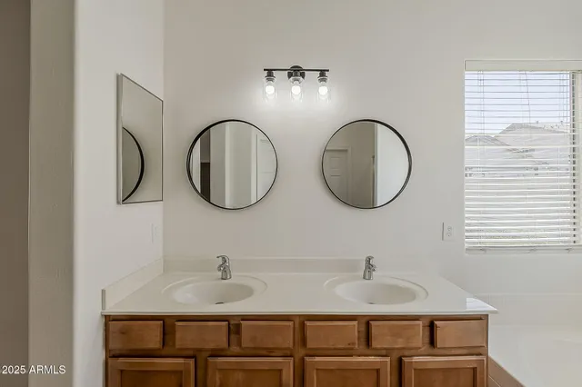 a bathroom with a bathtub and a window