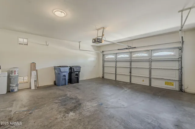 an empty room with a empty space and windows