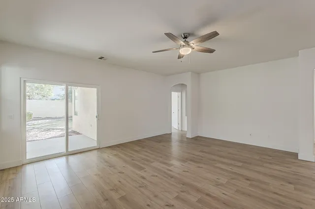 a view of a kitchen with a sink and a chandelier