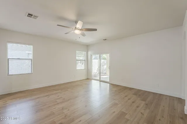 a kitchen with stainless steel appliances granite countertop a sink stove microwave and refrigerator