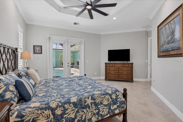 a bedroom with a large bed and a window