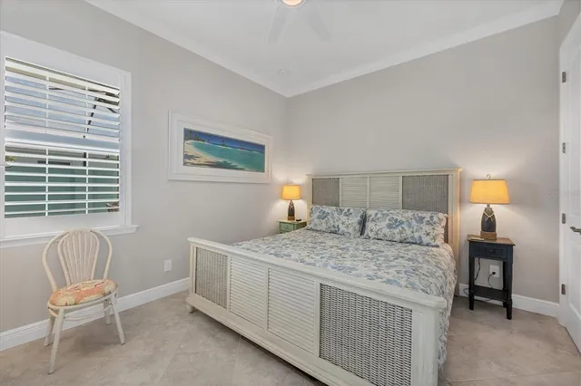 a bedroom with a bed and a chair