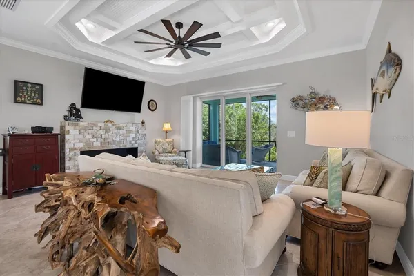 a living room with furniture fireplace and a flat screen tv