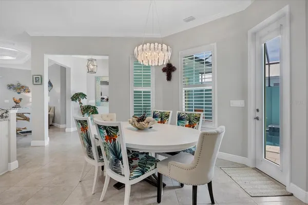 a view of a dining room with furniture window and outside view