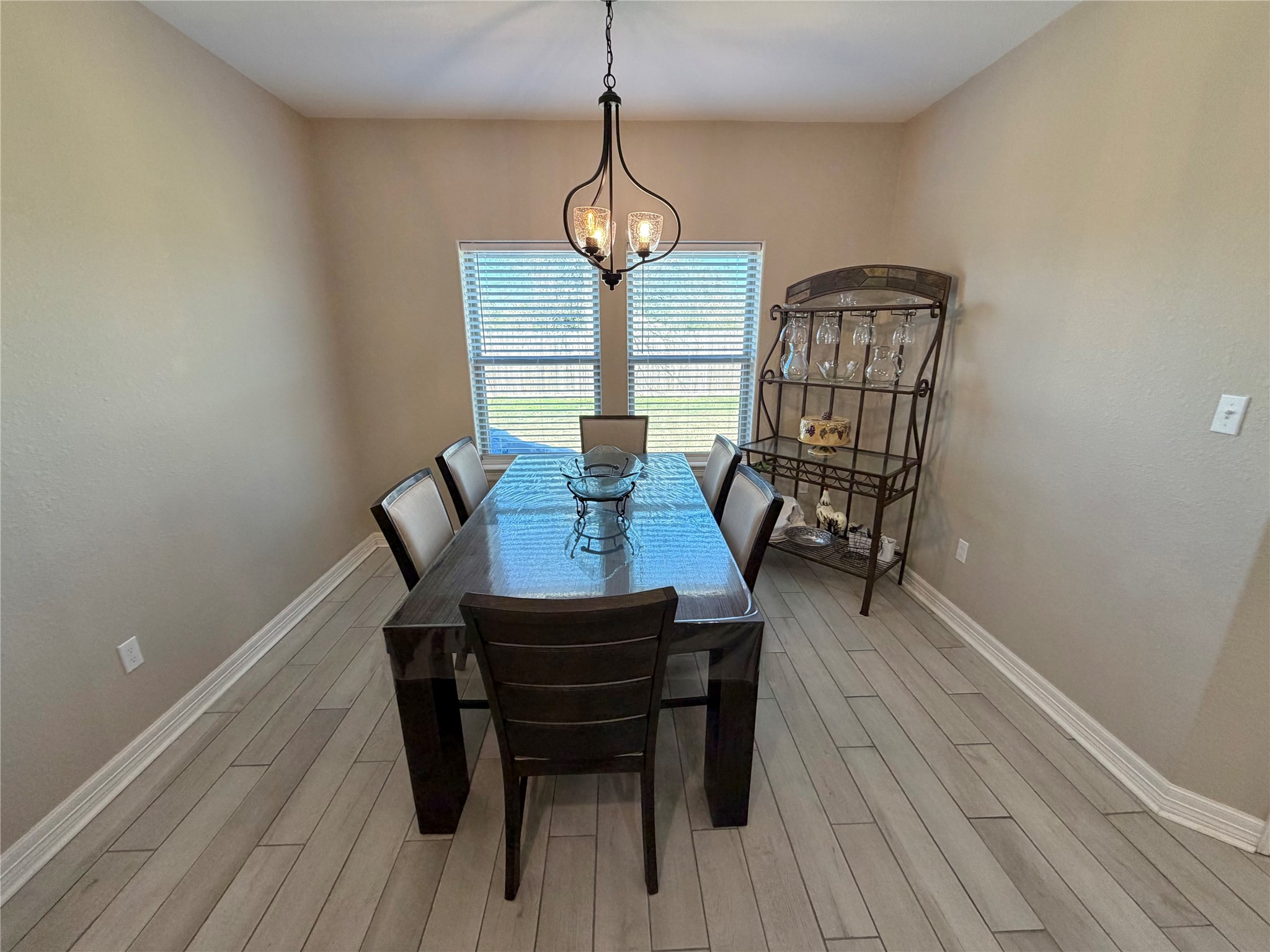216 Shannon Street Angleton, TX 77515 - Photo 12 of 26 a view of a dining room with furniture window and wooden floor