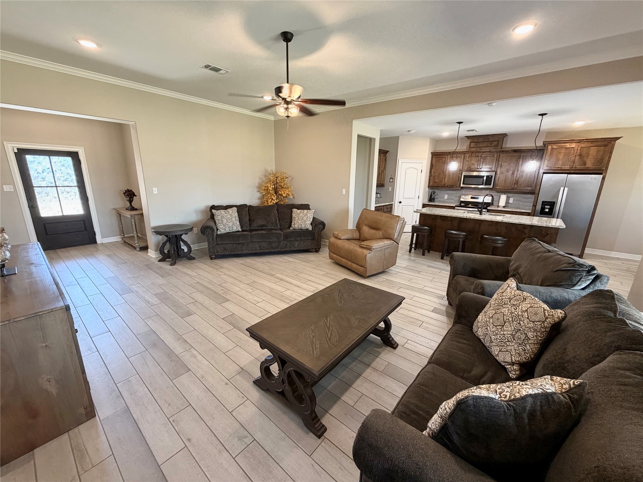 216 Shannon Street Angleton, TX 77515 - Photo 14 of 26 a living room with furniture and wooden floor
