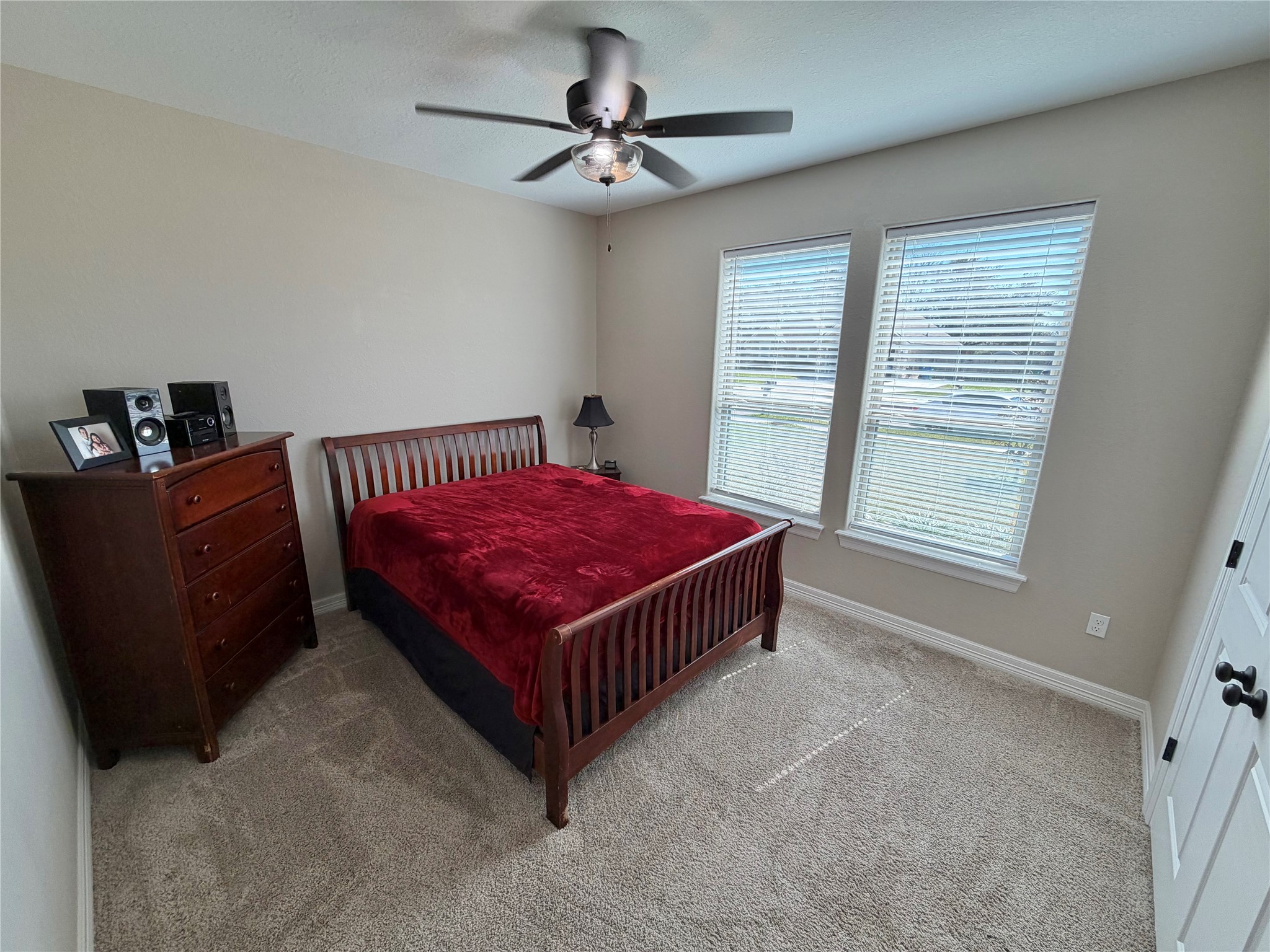 216 Shannon Street Angleton, TX 77515 - Photo 15 of 26 a bed room with a bed and a window