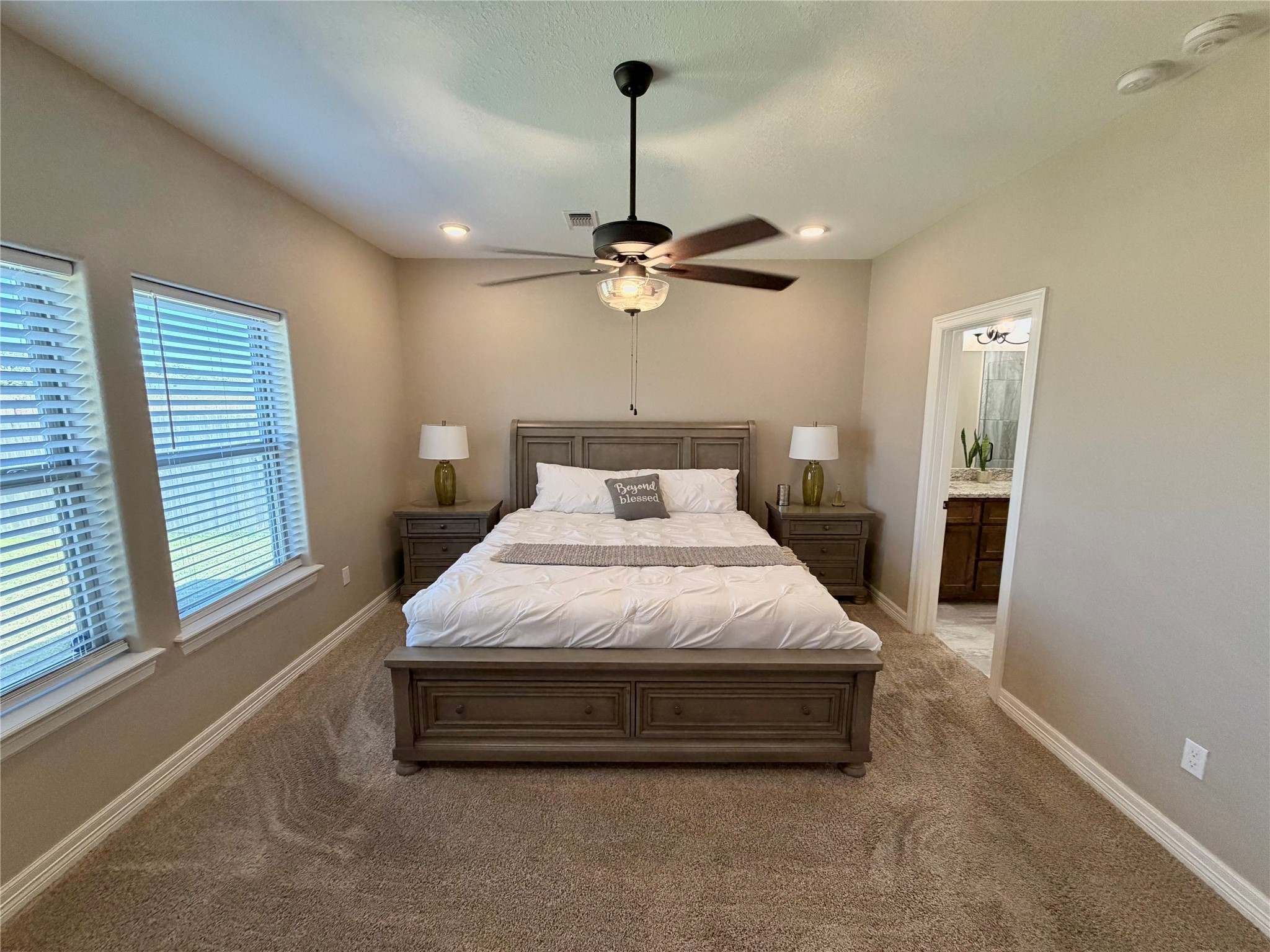 216 Shannon Street Angleton, TX 77515 - Photo 20 of 26 a spacious bedroom with a bed and a window