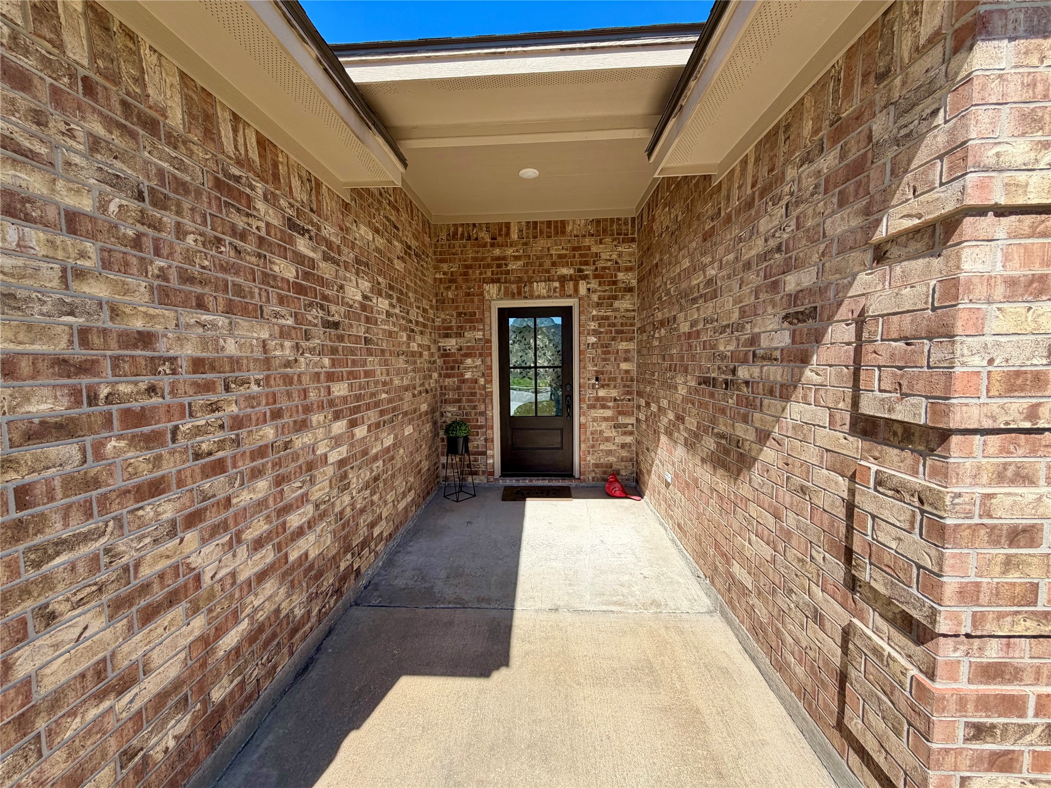 216 Shannon Street Angleton, TX 77515 - Photo 2 of 26 a view of a pathway along the building