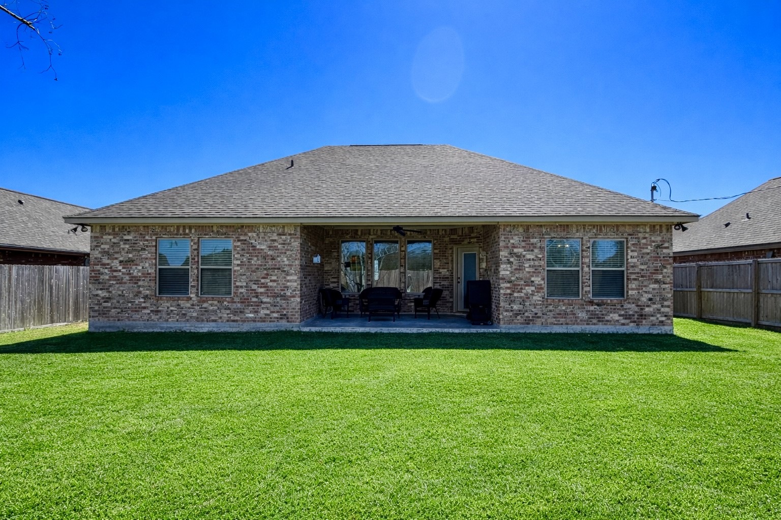 216 Shannon Street Angleton, TX 77515 - Photo 25 of 26 a front view of a house with a garden
