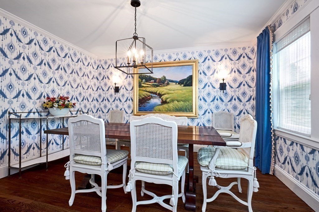 42 Buckmaster Road Westwood, MA 02090 - Photo 11 of 27 a view of a dining room with furniture wooden floor and a chandelier