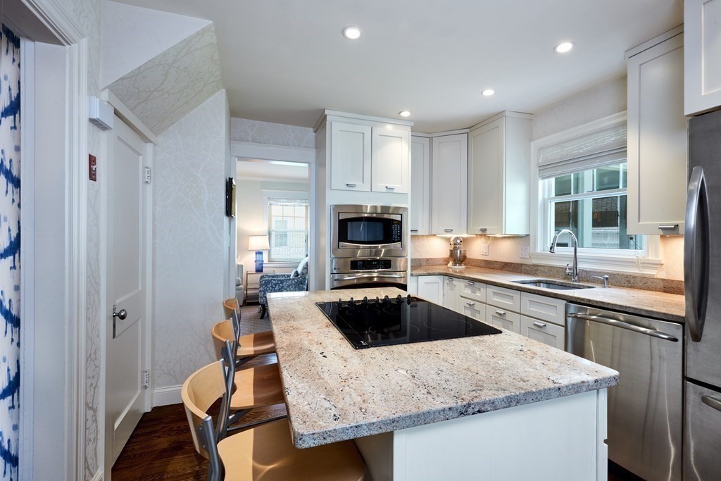 42 Buckmaster Road Westwood, MA 02090 - Photo 13 of 27 a kitchen with a stove a sink and a refrigerator