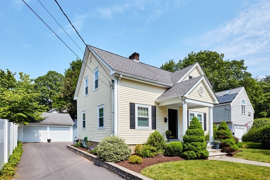 42 Buckmaster Road Westwood, MA 02090 - Photo 4 of 27 a front view of a house with a yard