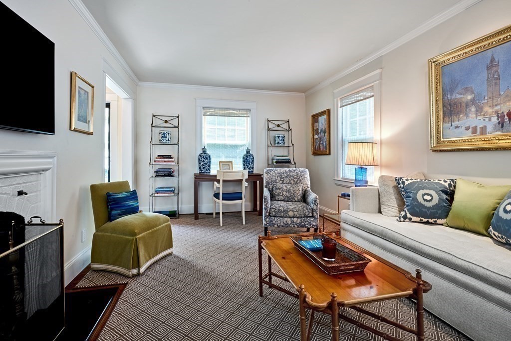 42 Buckmaster Road Westwood, MA 02090 - Photo 8 of 27 a living room with furniture and a flat screen tv