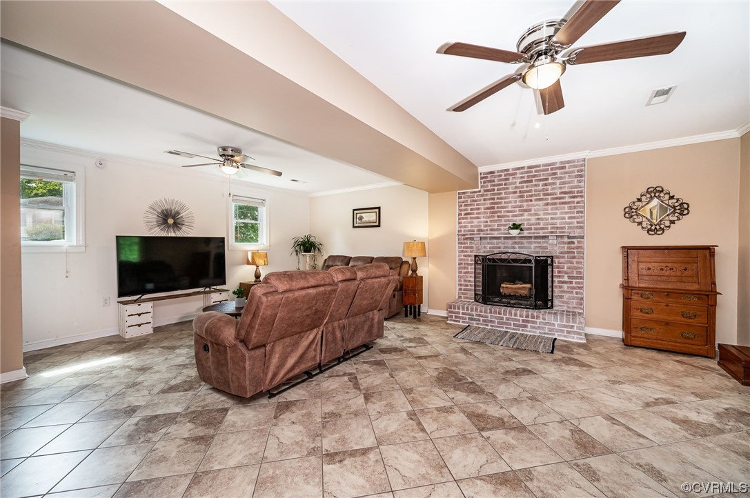 4202 Gladewater Road Henrico, VA 23294 - Photo 17 of 49 a living room with furniture a flat screen tv and a fireplace