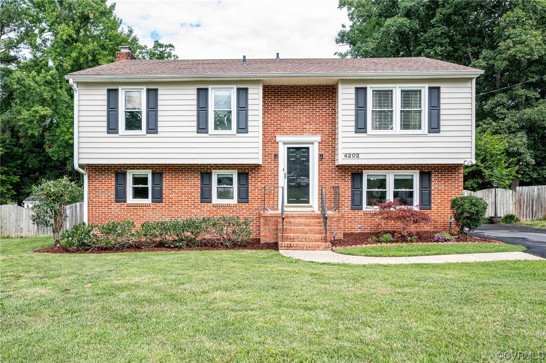 4202 Gladewater Road Henrico, VA 23294 - Photo 2 of 49 front view of a house with a yard