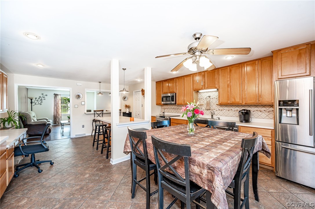 4202 Gladewater Road Henrico, VA 23294 - Photo 10 of 49 a view of a dining room with furniture window and wooden floor