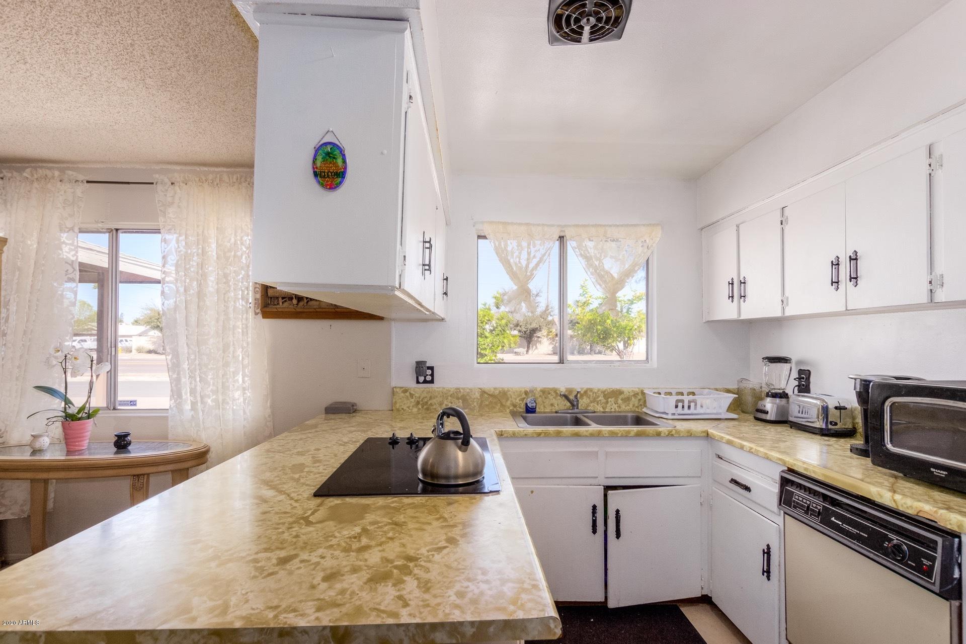 7019 West Camelback Road Phoenix, AZ 85033 - Photo 7 of 25 a kitchen with kitchen island sink stove and granite counter top