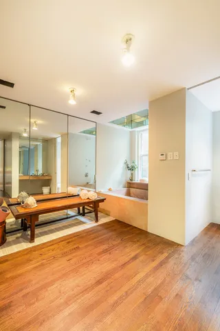a bathroom with a sink and mirror