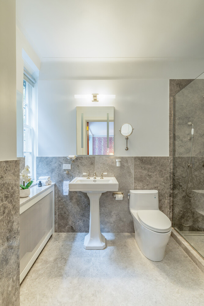 765 Park Avenue, Unit MASIONC Manhattan, NY 10021 - Photo 25 of 29 a bathroom with a toilet sink and mirror