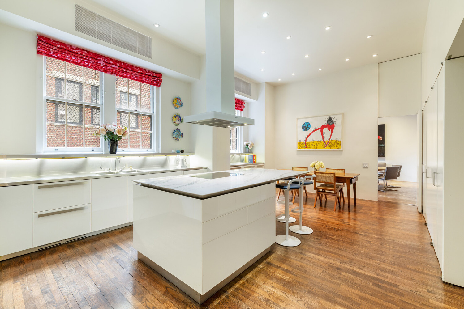 765 Park Avenue, Unit MASIONC Manhattan, NY 10021 - Photo 7 of 29 a kitchen with a sink cabinets and wooden floor