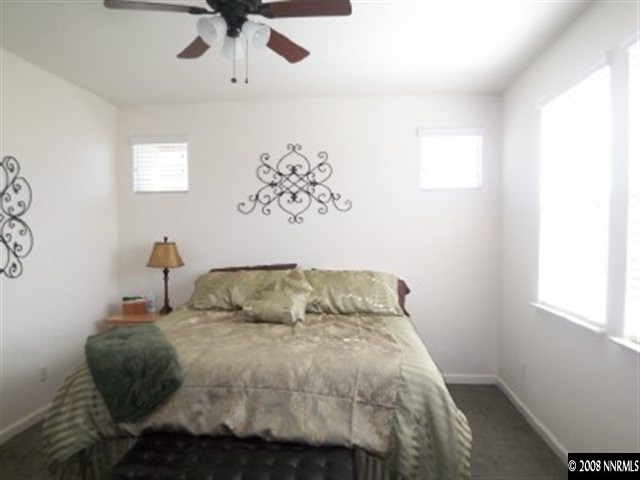 2185 Stanton Lane Reno, NV 89502 - Photo 6 of 9 a bedroom with a bed and a window