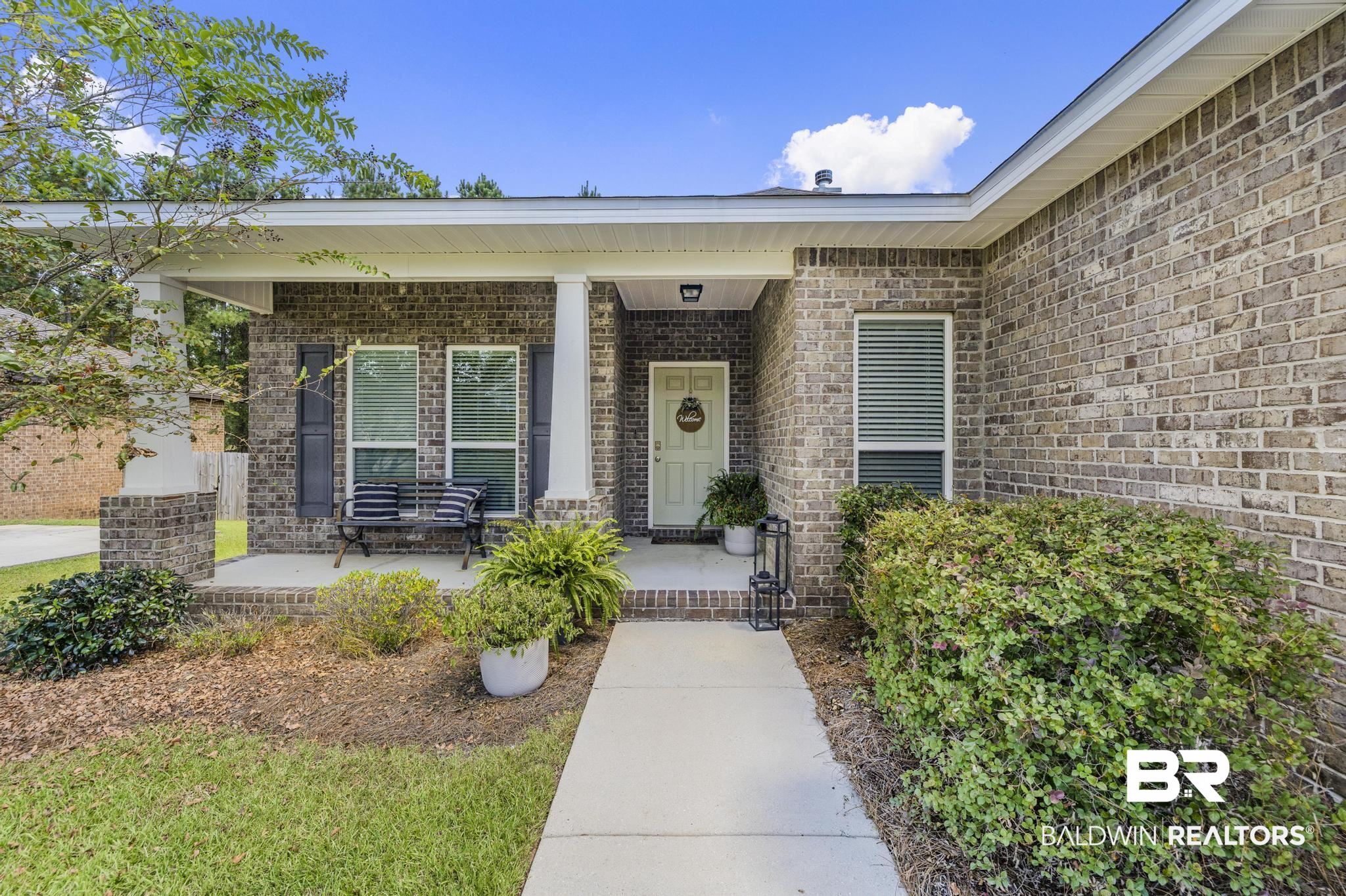 31336 Hoot Owl Road Daphne, AL 36527 - Photo 25 of 36 Property entrance with covered porch and brick siding