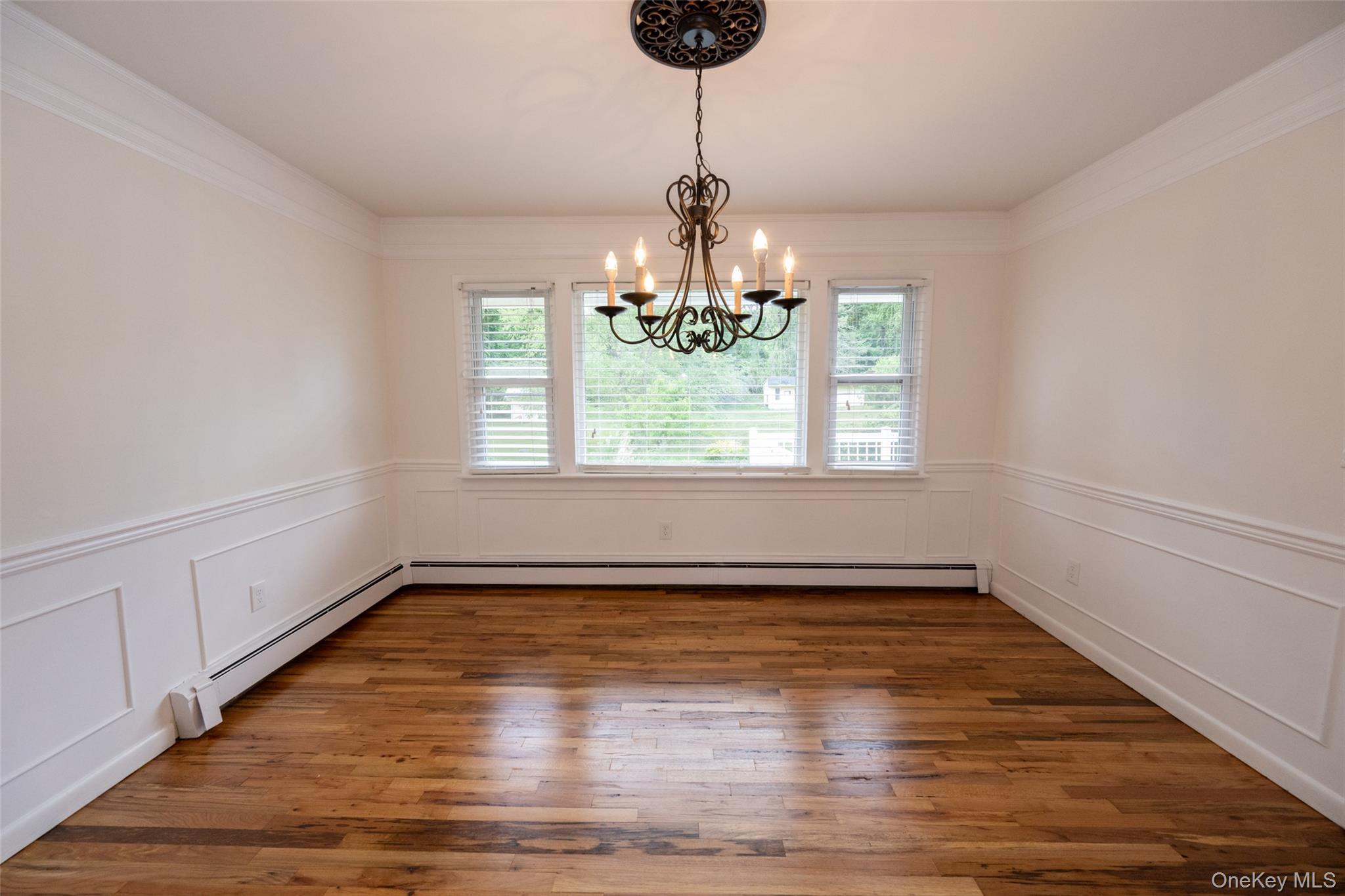 136 Foggintown Road Brewster, NY 10509 - Photo 16 of 50 a view of an empty room with wooden floor and a window