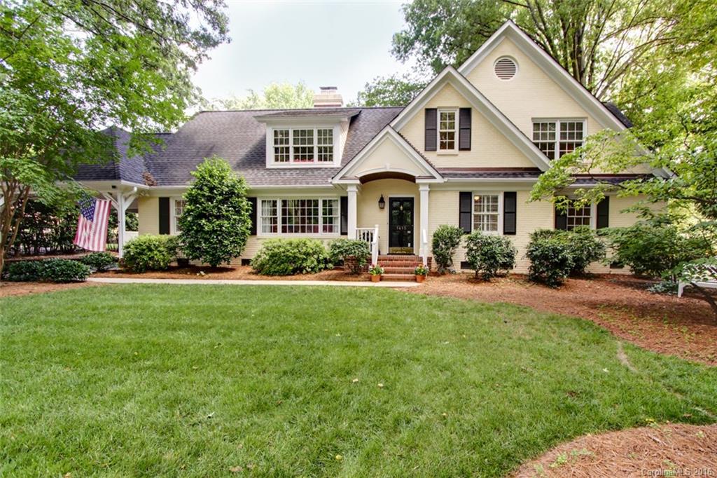 1415 Coventry Road Charlotte, NC 28211 - Photo 1 of 18 a front view of a house with porch and garden