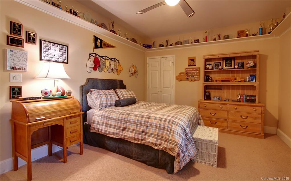 1415 Coventry Road Charlotte, NC 28211 - Photo 14 of 18 a bedroom with a bed and a cabinets