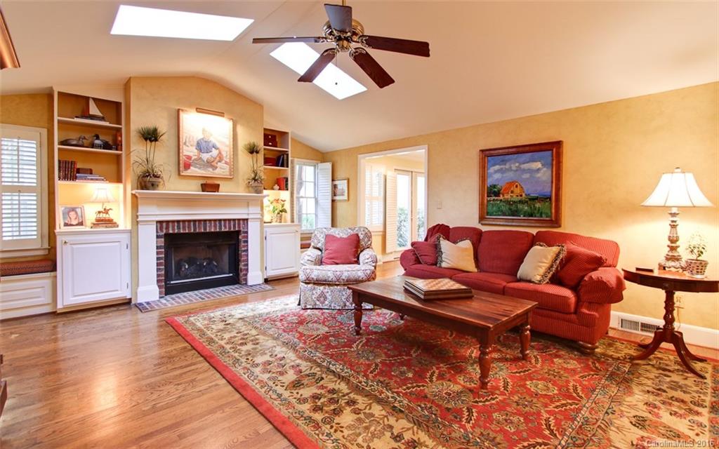 1415 Coventry Road Charlotte, NC 28211 - Photo 4 of 18 a living room with furniture and a fireplace