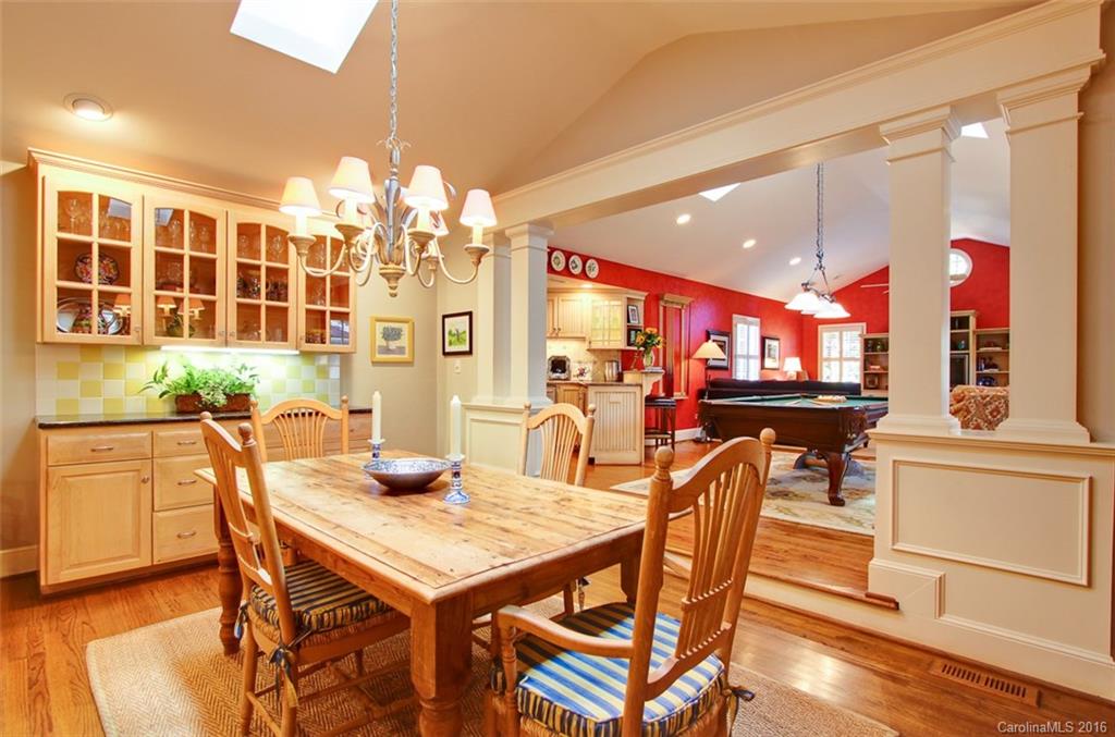 1415 Coventry Road Charlotte, NC 28211 - Photo 7 of 18 a view of a dining room with furniture window and wooden floor