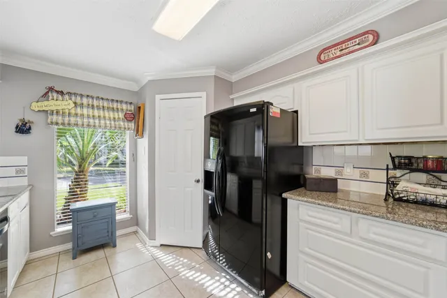 a kitchen with a sink cabinets and stainless steel appliances